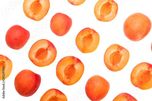 Slices of fresh juicy apricot on a white background. Orange fruit for jam. Sweet vegan healthy food. A lot of apricots.