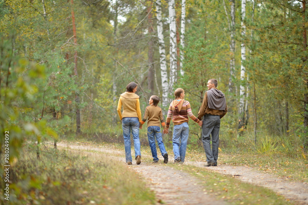 Portrait of family of four in park Portrait of family of four in park