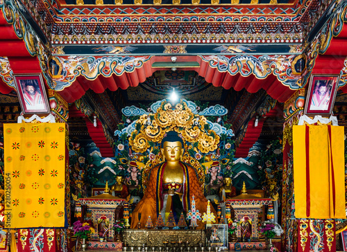 Lord Buddha Statue in Bhutanese style inside The Royal Bhutanese Monastery that decorated in Bhutanese art in Bodh Gaya, Bihar, India.