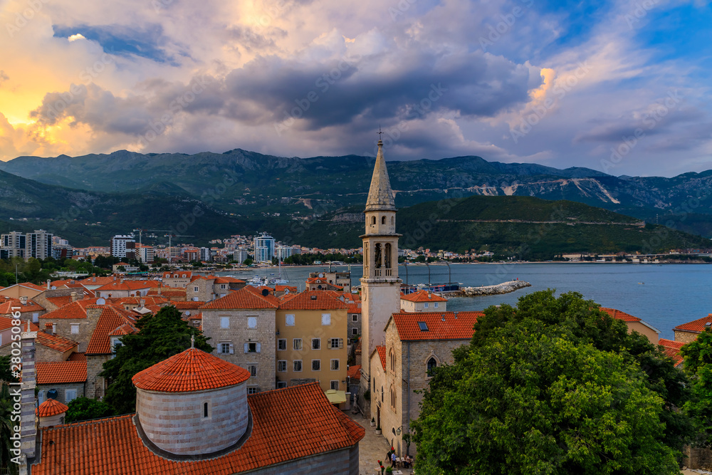 Budva Old Town aerial sunset view from the Citadel with the Holy Trinity church and Adriatic Sea in Montenegro, Balkans
