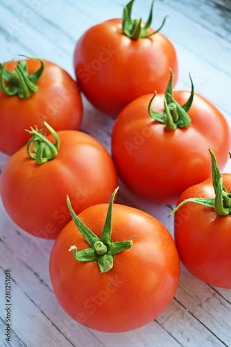 Delicious,ripe tomatoes on a wooden background.Healthy diet.