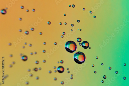 beautiful vials of air in water on a multi-colored background.The texture of water on the glass