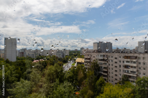 Water drops on the window glass on background of Moscow