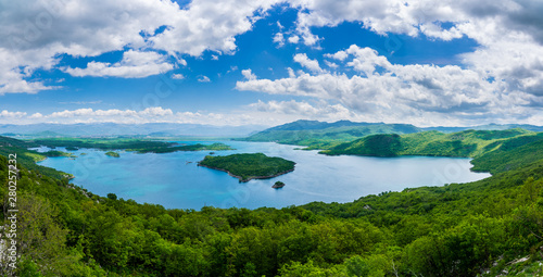 Montenegro  XXL panorama of wide view over green peninsulas and mountains around lake slano near niksic nature landscape from above with blue sky