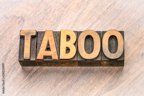 Fotografija taboo word in letterpress wood type
