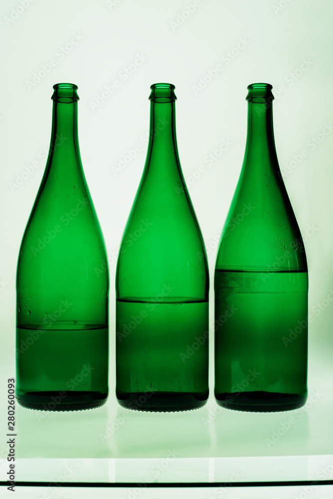 three green water bottles three green water bottles