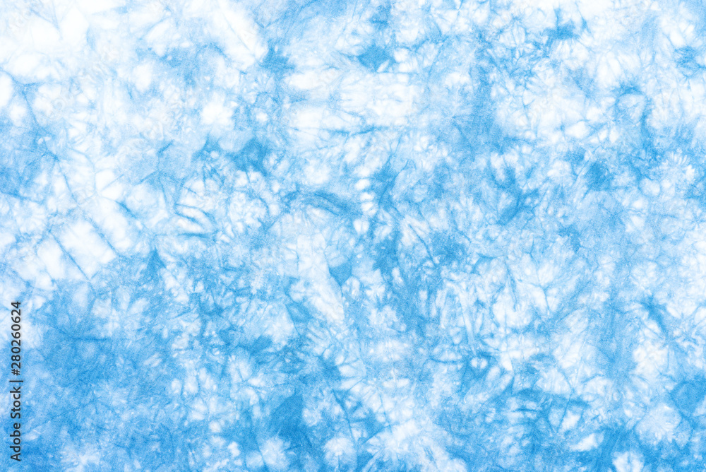 Fototapeta premium tie dye pattern hand dyed on cotton fabric abstract background.