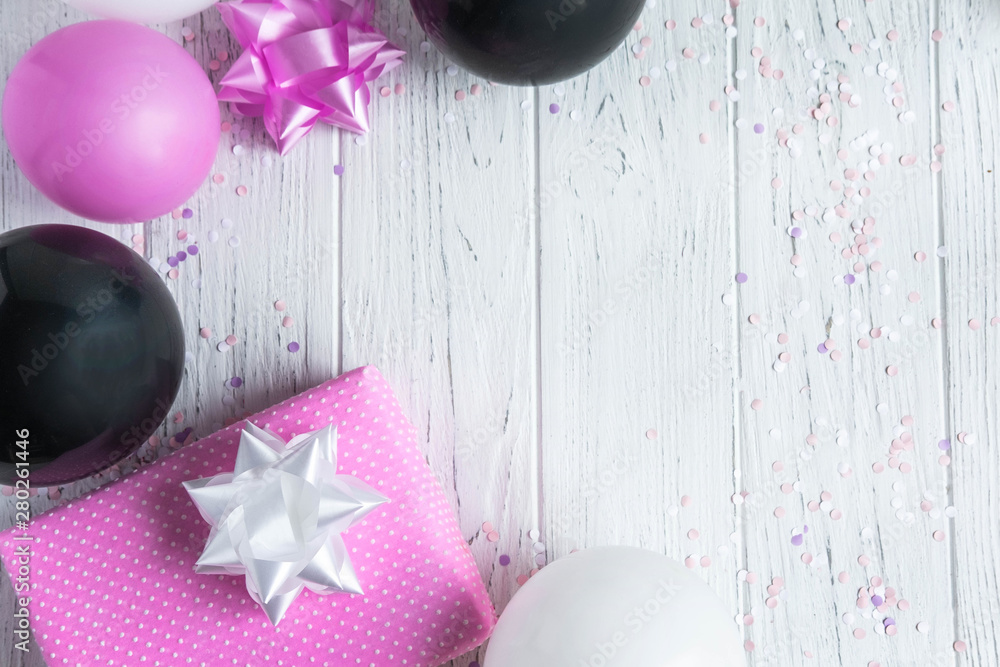 Design frame for birthday card background. Pink, white and black balloons  with a gift box on a light wooden background. Greeting card design Stock  Photo | Adobe Stock