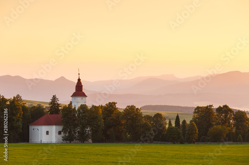 Rural landscape with a church in Turiec region, central Slovakia.
