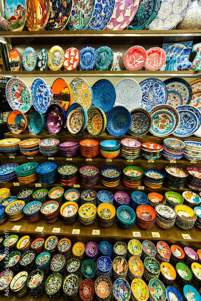 Colorful dishes on the counter of a trading shop in the Grand Bazaar of Istanbul. Traditional Turkish ceramics 