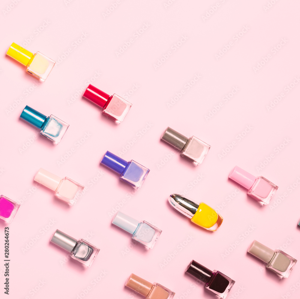Nail polish bottles pattern background. Close up. Nail polish bottles pattern background. Close up.