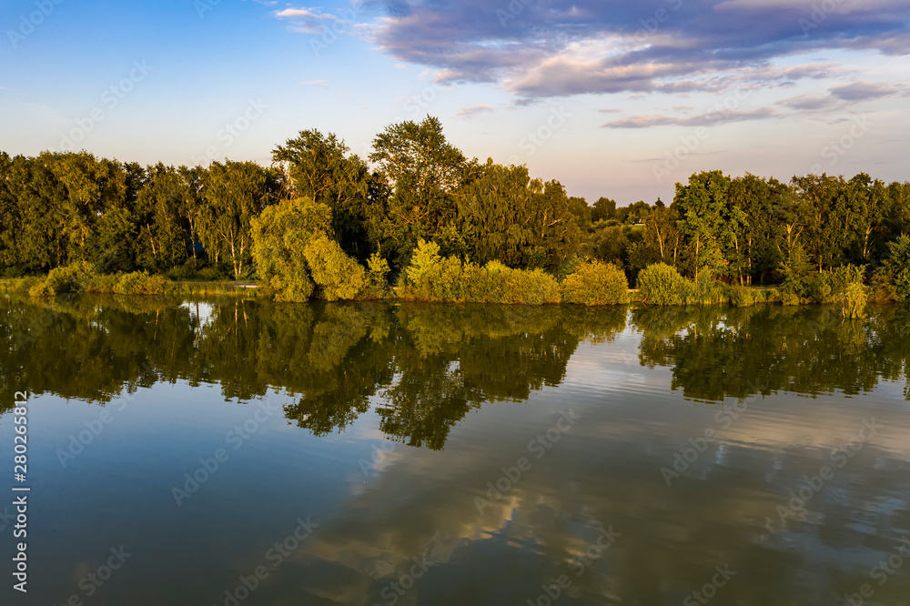 Aerial view of the lake in the middle climatic zone , roads and villages surrounding it