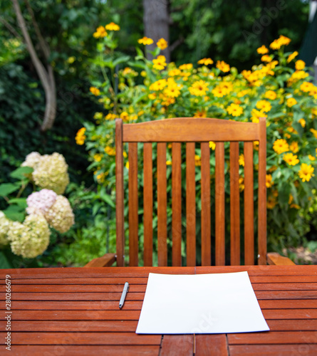 Wooden table with a sheet o...