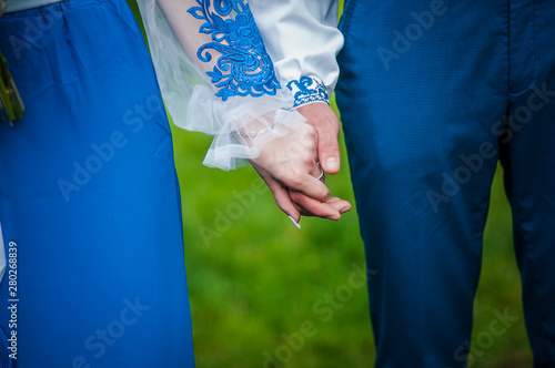 Man and woman holding hands together