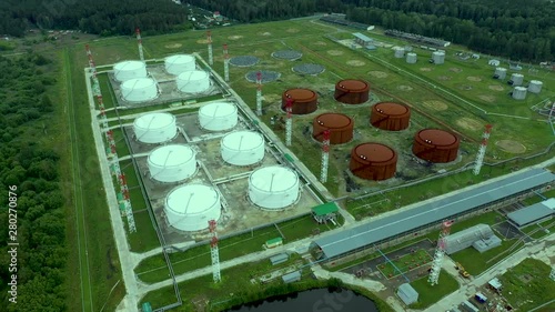 Aerial bird eye view oil depot sometimes called tank farm or oil terminal is industrial facility for storage of oil and petrochemical products ready for transport to further storage facilities 4k photo