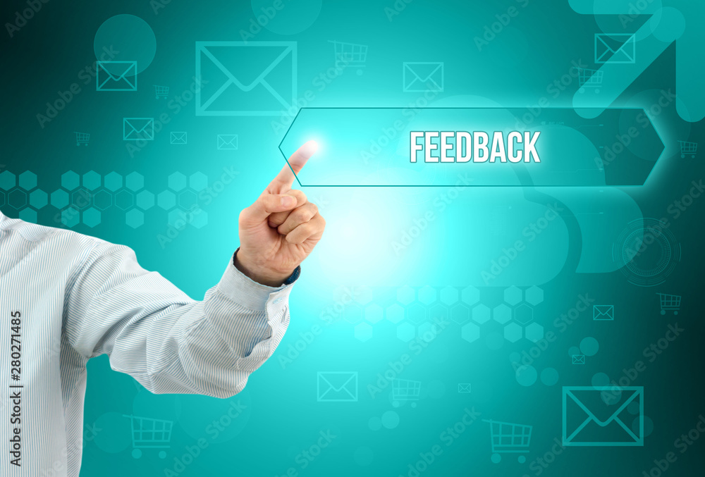 Business man touch a button on an imaginary screen with text FEEDBACK Business man touch a button on an imaginary screen with text FEEDBACK