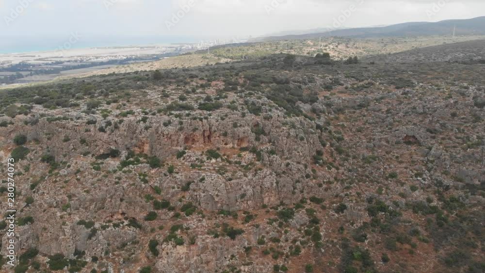 The slopes of Mount Carmel with rich vegetation and caves. View from the drone. Northern Israel. The slopes of Mount Carmel with rich vegetation and caves. View from the drone. Northern Israel.