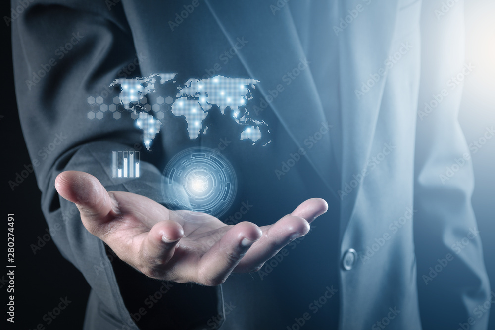 Fototapeta premium business man and hand holding world map of data and information network