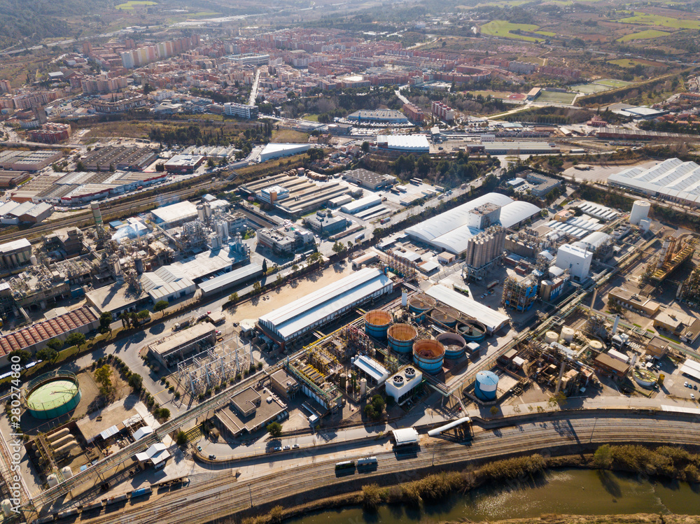 Fototapeta premium Top view of the chemical plant and the surrounding area