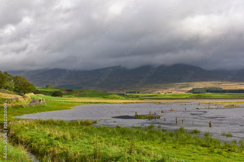 After heavy Summer rain the South Esk river broke its banks and flooded the Valley Floor of Glen Clova in the Angus Glens, Scotland. After heavy Summer rain the South Esk river broke its banks and flooded the Valley Floor of Glen Clova in the Angus Glens, Scotland.