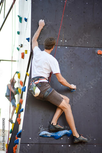 Man with arms wide concentrate and prepare to wall climbing © freshstockplace