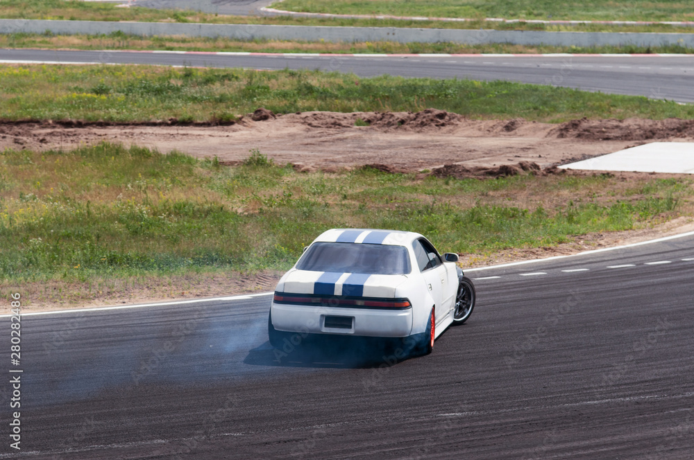 racing car in a skid. drift, tire smoke. sports car. extreme sport