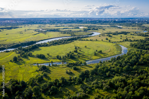 aerial landscape of winding river Klyazma in green field, top view of beautiful nature texture from drone/ Vladimir city Russia