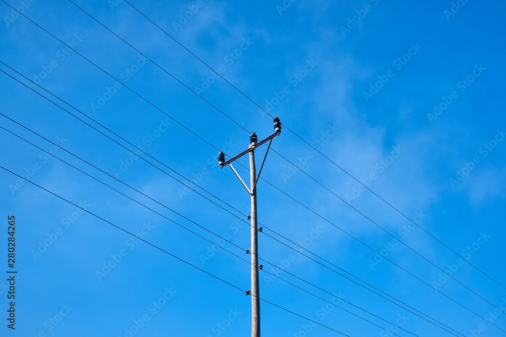 Electric pole and wires, wood electricty pole and cloudy blue sky Electric pole and wires, wood electricty pole and cloudy blue sky