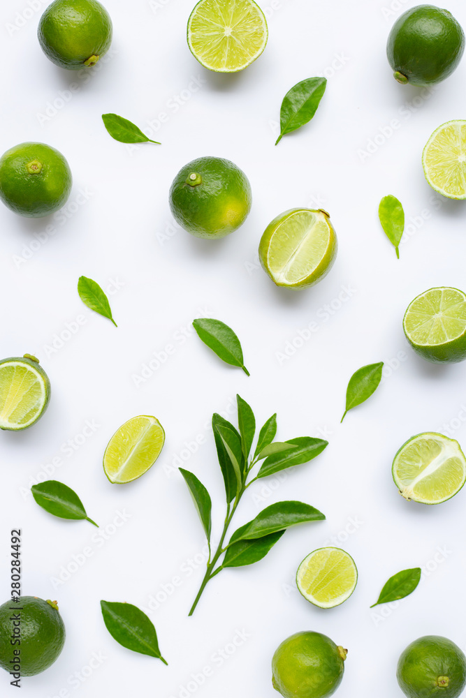 Limes with leaves isolated on white. Limes with leaves isolated on white.