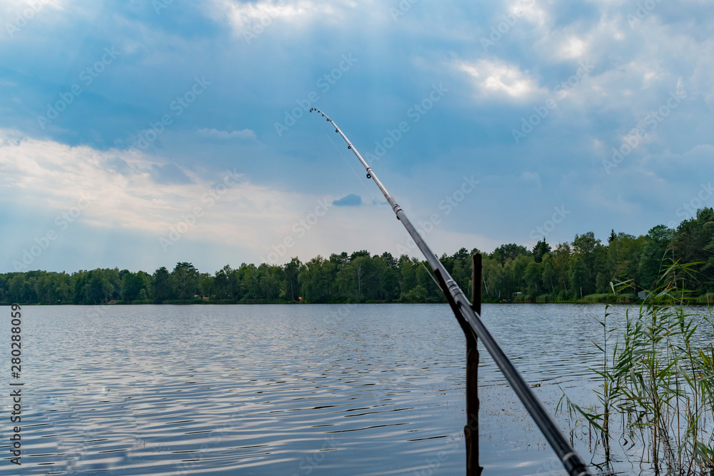 Fishing rod installed on the shore Fishing rod installed on the shore