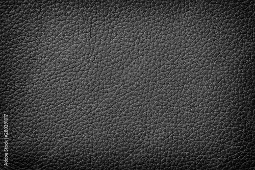 Texture of genuine leather close-up, cowhide. Black color. For natural, artisan backgrounds, substrate composition use, vintage design