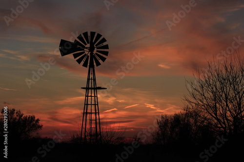 Kansas windmill after sunset