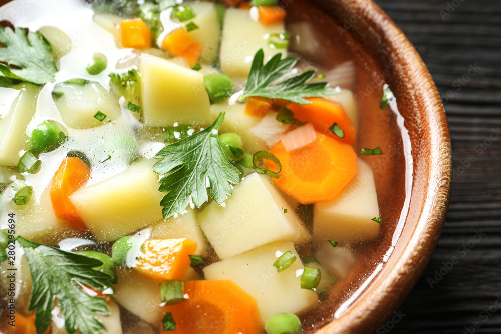 Bowl of fresh homemade vegetable soup on table, closeup Bowl of fresh homemade vegetable soup on table, closeup