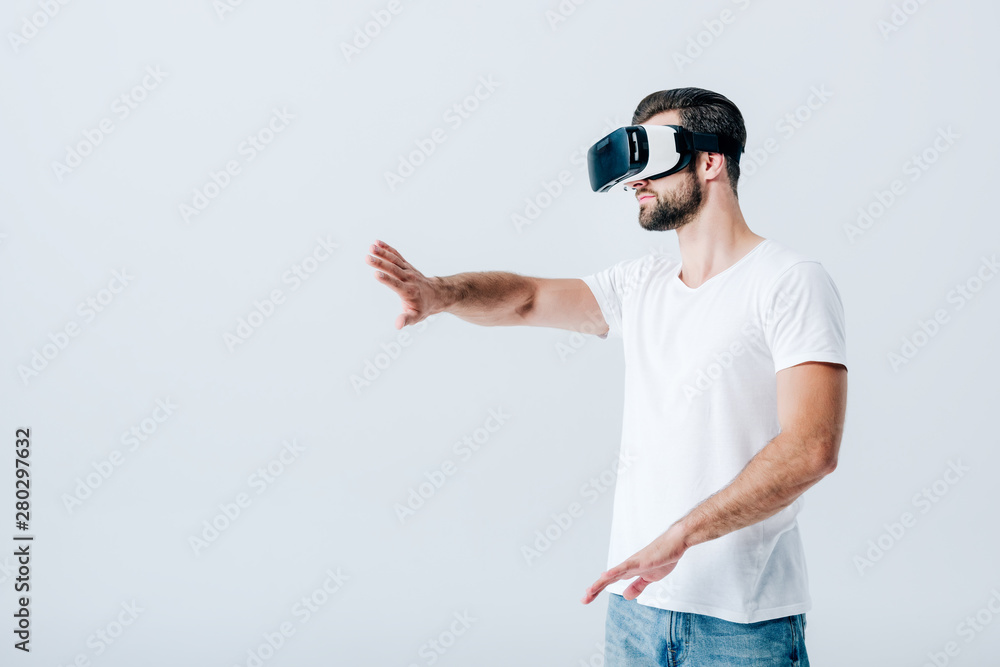 bearded man in Virtual reality headset gesturing isolated on grey bearded man in Virtual reality headset gesturing isolated on grey