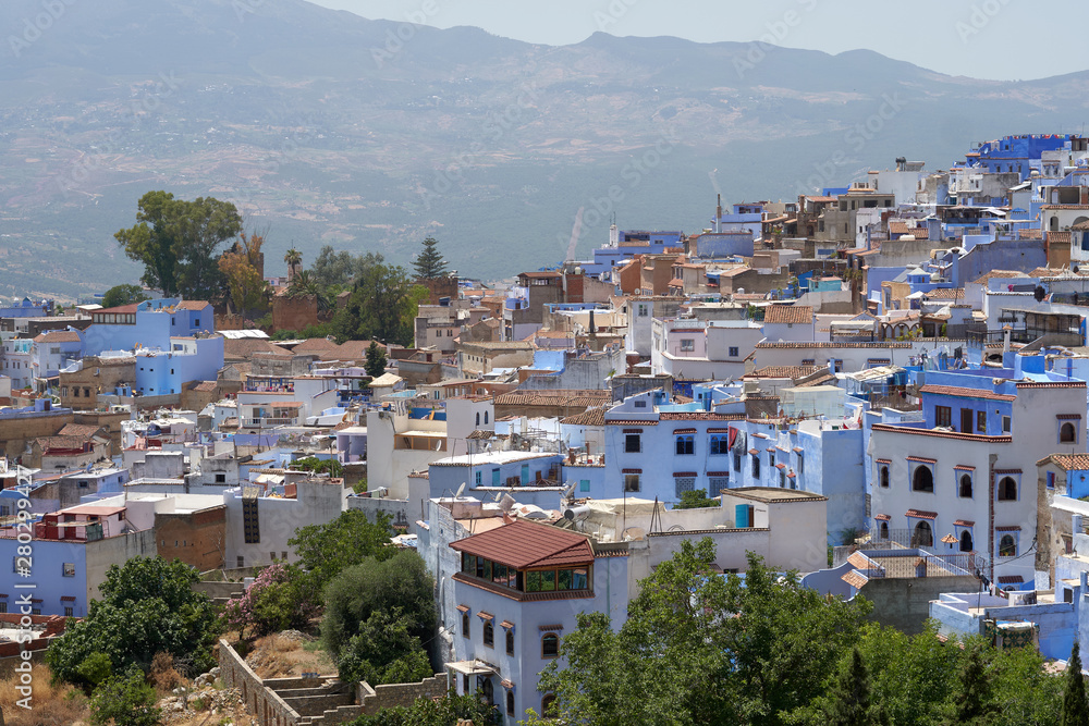 Panoramic aerial view to the old medina of a blue Chefchaouen town in Morocco.