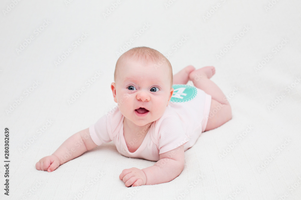 Portrait of 4 Month Old Cute Baby Girl with Big Eyes, Infant ,lying on the white bed, New family concept, The most Beautiful Baby Princesse, Happy Baby Girl Portrait of 4 Month Old Cute Baby Girl with Big Eyes, Infant ,lying on the white bed, New family concept, The most Beautiful Baby Princesse, Happy Baby Girl