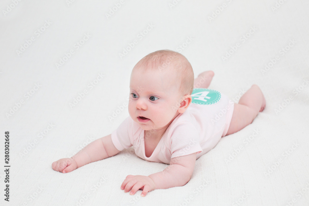 Portrait of 4 Month Old Cute Baby Girl with Big Eyes, Infant ,lying on the white bed, New family concept, The most Beautiful Baby Princesse, Happy Baby Girl Portrait of 4 Month Old Cute Baby Girl with Big Eyes, Infant ,lying on the white bed, New family concept, The most Beautiful Baby Princesse, Happy Baby Girl