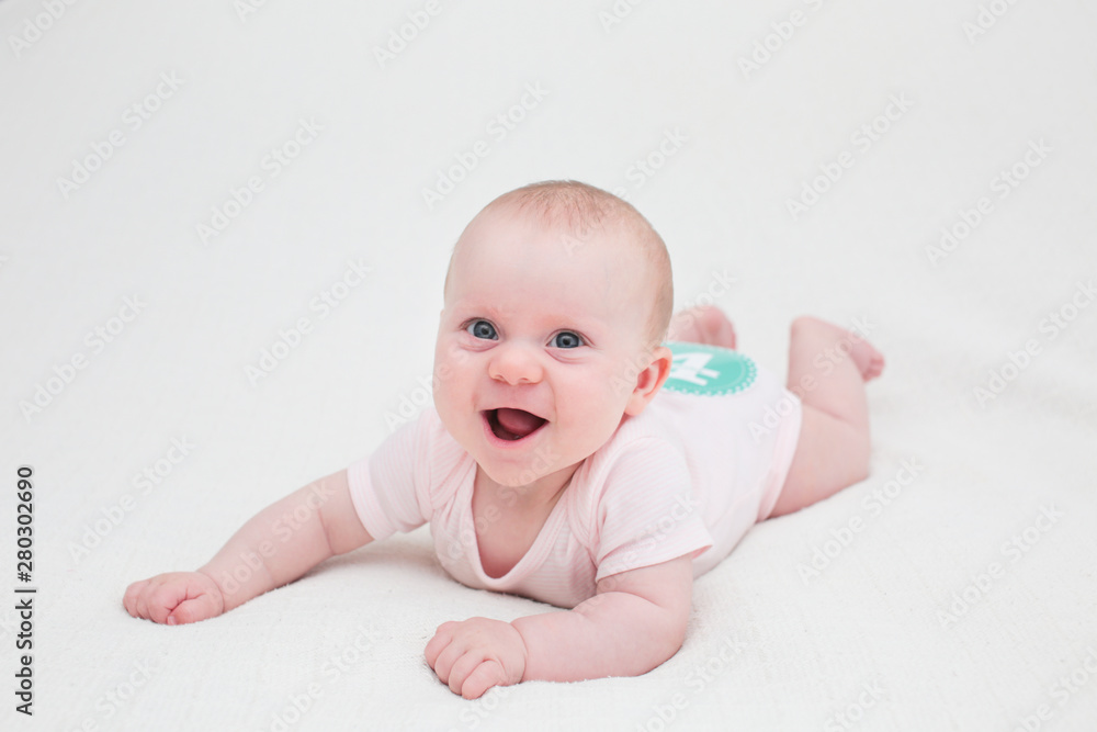 Portrait of 4 Month Old Cute Baby Girl with Big Eyes, Infant ,lying on the white bed, New family concept, The most Beautiful Baby Princesse, Happy Baby Girl Portrait of 4 Month Old Cute Baby Girl with Big Eyes, Infant ,lying on the white bed, New family concept, The most Beautiful Baby Princesse, Happy Baby Girl