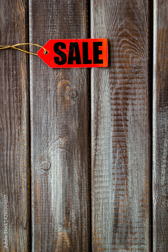 Sale in shop with lable on wooden background top view mockup