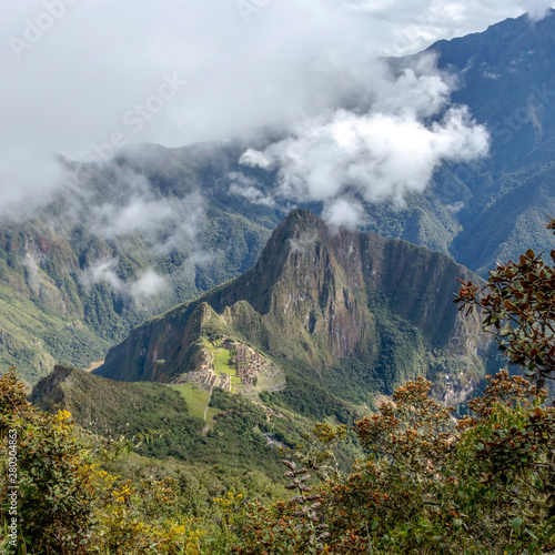 Huayna Picchu, or Wayna Pikchu, mountain in clouds rises over Machu Picchu Inca citadel, lost city of the Incas © nomadkate