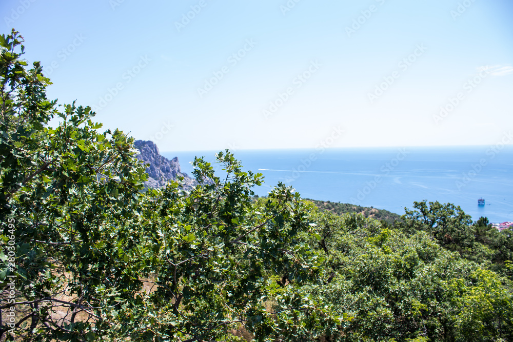 Black Sea view from the mountain. Light sunny summer day, Crimea, Russia.