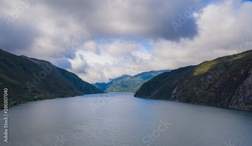 View on beautiful landscape with water of fjord and mountains at sunny summer day, Akrafjorden, Hordaland,Hardangervidda, Norway photo