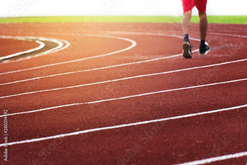 blur leg running man in stadium track line in sport stadium background