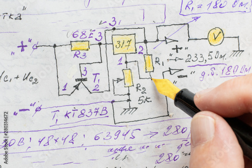 macro view of engineer planing the electrical circuit on paper