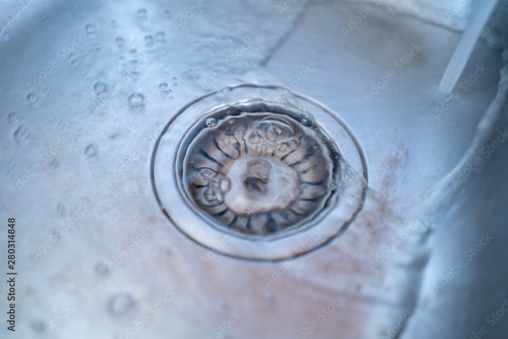 close up water pours throught the wash sink close up water pours throught the wash sink