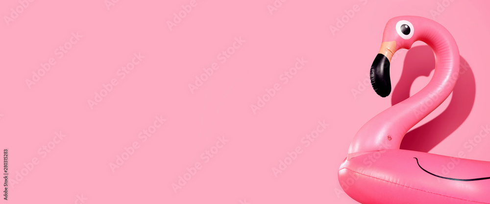 Giant inflatable Flamingo on a pink background, pool float party, trendy summer concept, banner background with copy space - obrazy, fototapety, plakaty 