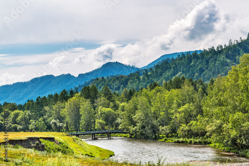 Mountain landscape with river and bridge. Altai Republic, Russia