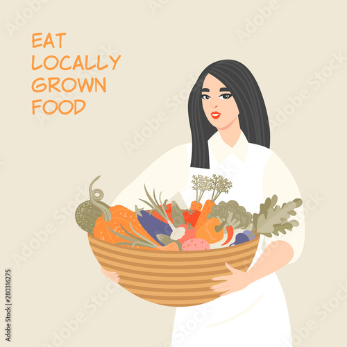 Cute girl holding a basket with various vegetables