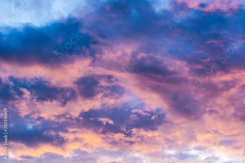 Beautiful sky with multicolored clouds at sunset. © HappyRichStudio