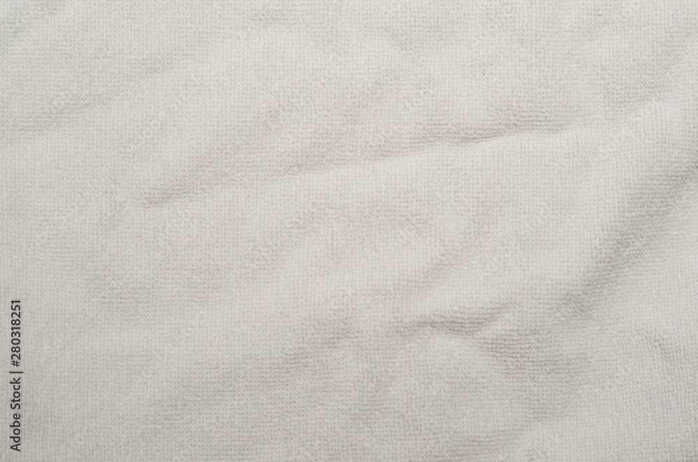 Wrinkled white towel background. texture of bright white bath towel